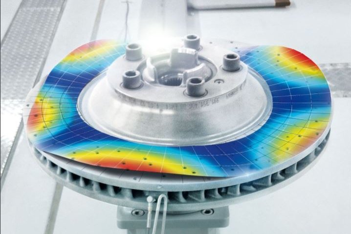 MIMO modal test setup with a Scanning Vibrometer measuring a brake disk and modal excitation by a modal hammer MIMO modal test setup with a Scanning Vibrometer measuring a brake disk and modal excitation by a modal hammer